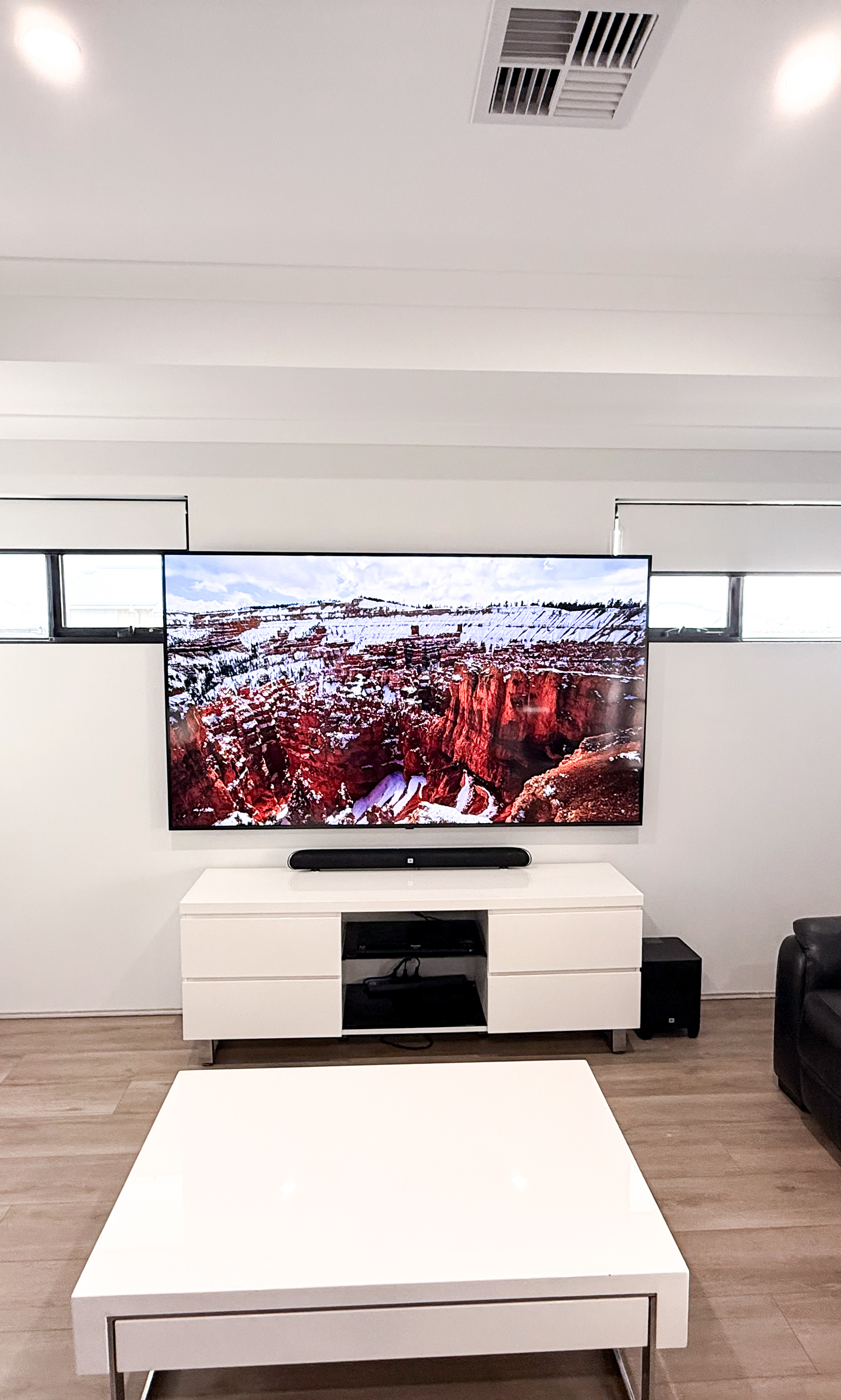 Wall mounted TV with clean cable management and soundbar installation in Perth