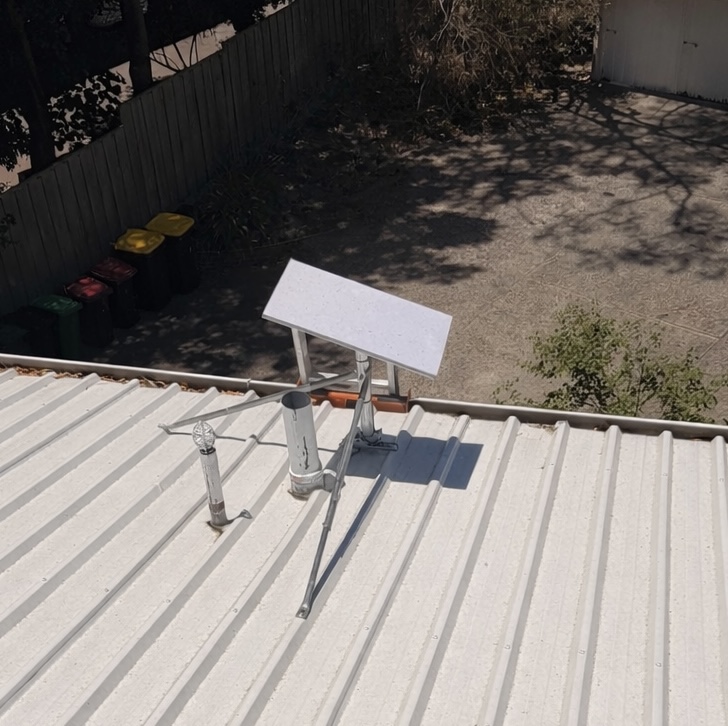 Technician aligning Starlink dish in Perth